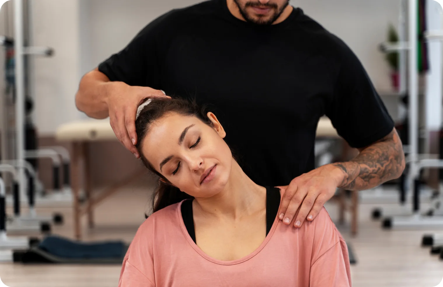 Chiropractor examining a patient's neck and shoulders